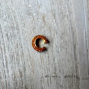 Gold rhinestone ear cuff. It’s really good stacked